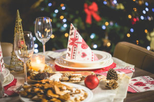 A table set with festive decorations for a holiday dinner.